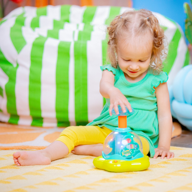 Дзиґа музична Bright Starts Press & Glow Spinner